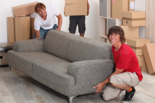 Family moving items into a mobile self storage unit in Leytonstone
